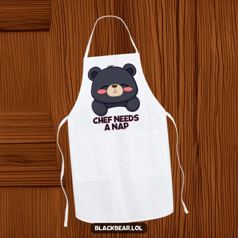 Funny black bear apron showing a bear lounging with a contented sigh and closed eyes, bringing kitchen humor.