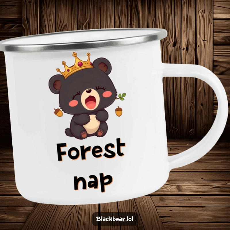 Funny camping mug with a sleepy black bear cub wearing an acorn crown, yawning during an outdoor scene.