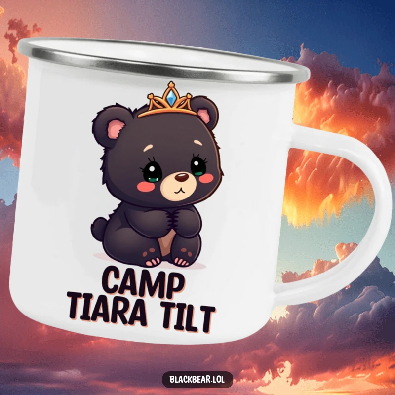 Funny black bear cub camping mug with a tiara askew, looking confusedly delighted, for outdoor charm.