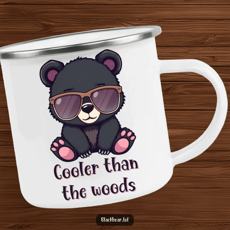 Funny camping mug showing a black bear cub wearing oversized sunglasses, looking cool and ready for adventure.