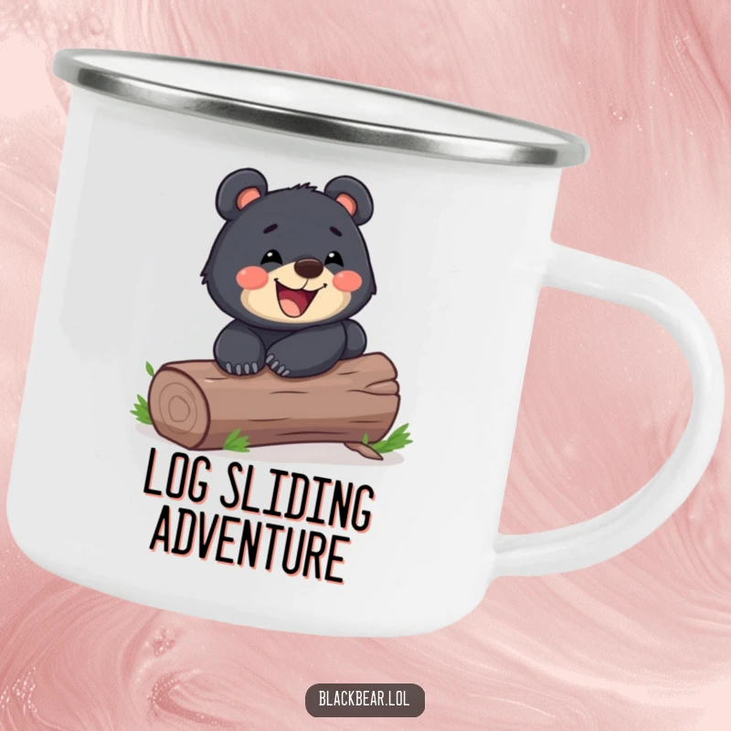 Funny playful black bear cub sliding down a log with a wide grin on a rugged camping mug. Joyful and humorous forest animal enamel cup.