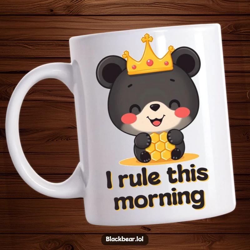 Funny mug featuring a happy black bear cub wearing a tiny crown, expertly balancing a honeycomb on its nose, looking absolutely delighted.