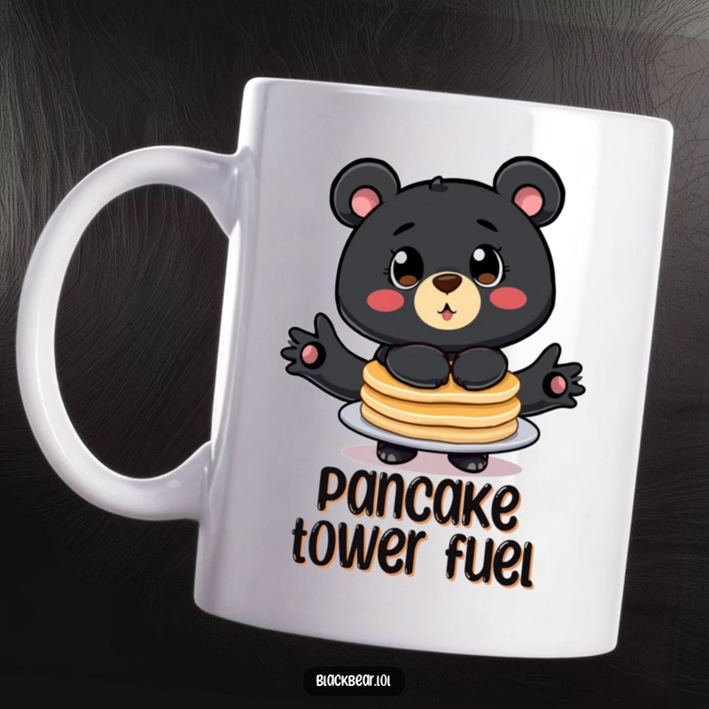 Funny mug showing a stylized black bear with big eyes comically balancing a tall stack of pancakes, ready to tumble.