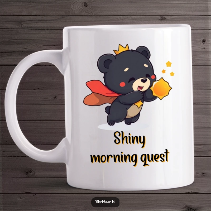 Funny mug featuring a black bear cub wearing a regal cape, playfully lunging towards a glinting, shiny object with excitement.