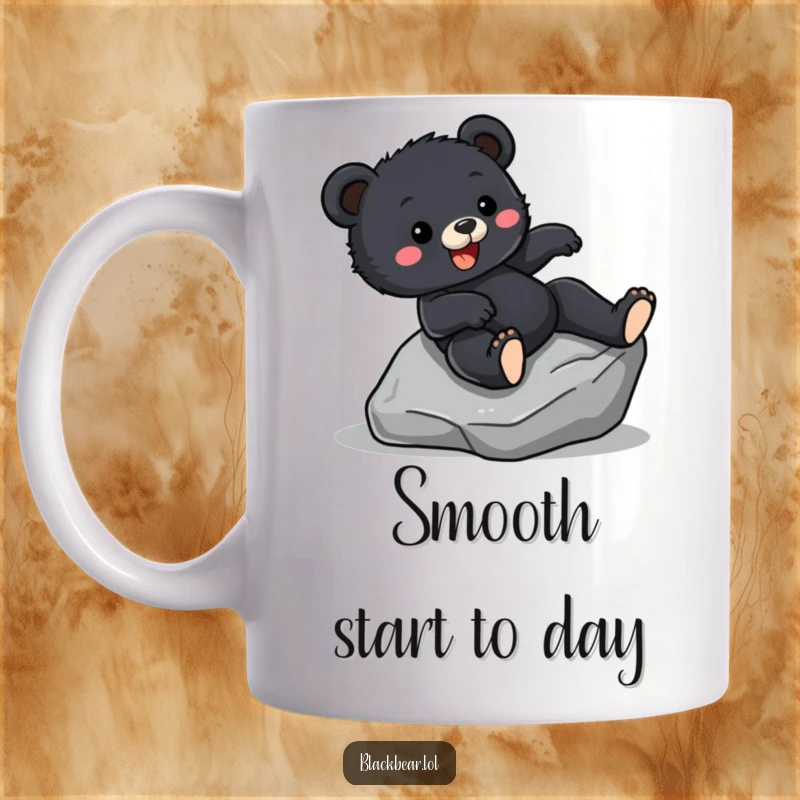 Funny Mug showing a black bear cub sliding down a smooth rock face with pure joy and excitement on its face.