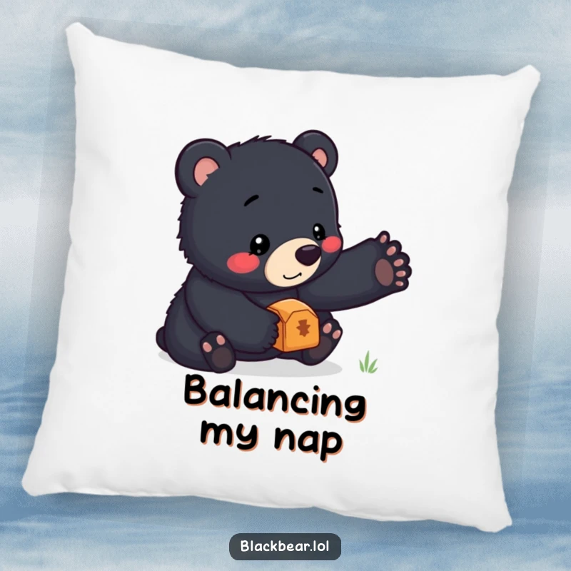 Funny pillow featuring a cute black bear cub concentrating intently while balancing a small, shiny treasure on its nose, perfect for cozying up.
