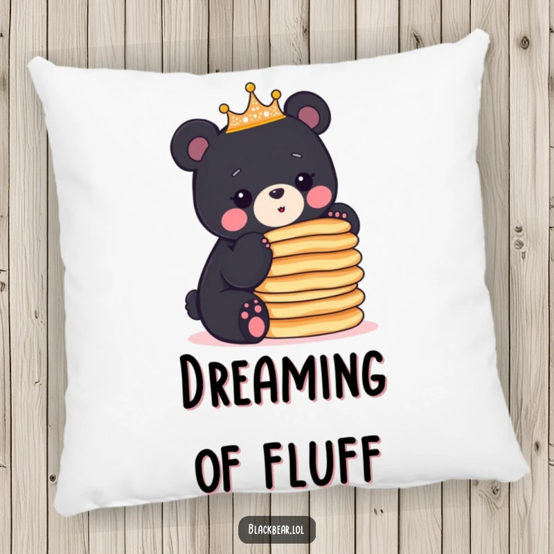 Funny crowned black bear cub balancing a stack of pancakes, adding a humorous and cozy touch to this pillow.