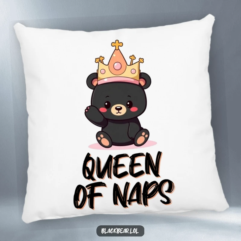 Funny pillow with a black bear cub comically wearing a huge, bejeweled princess hat, offering plush humor.