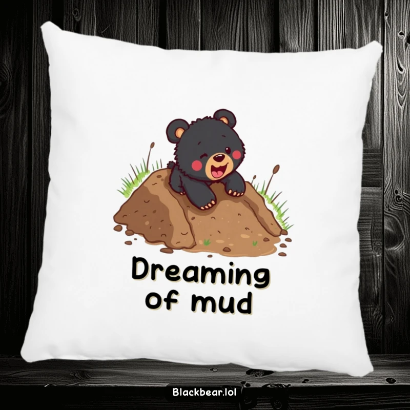 Funny black bear cub headfirst in the mud after a playful slide, depicted on a soft, decorative pillow for maximum comfort and humor.