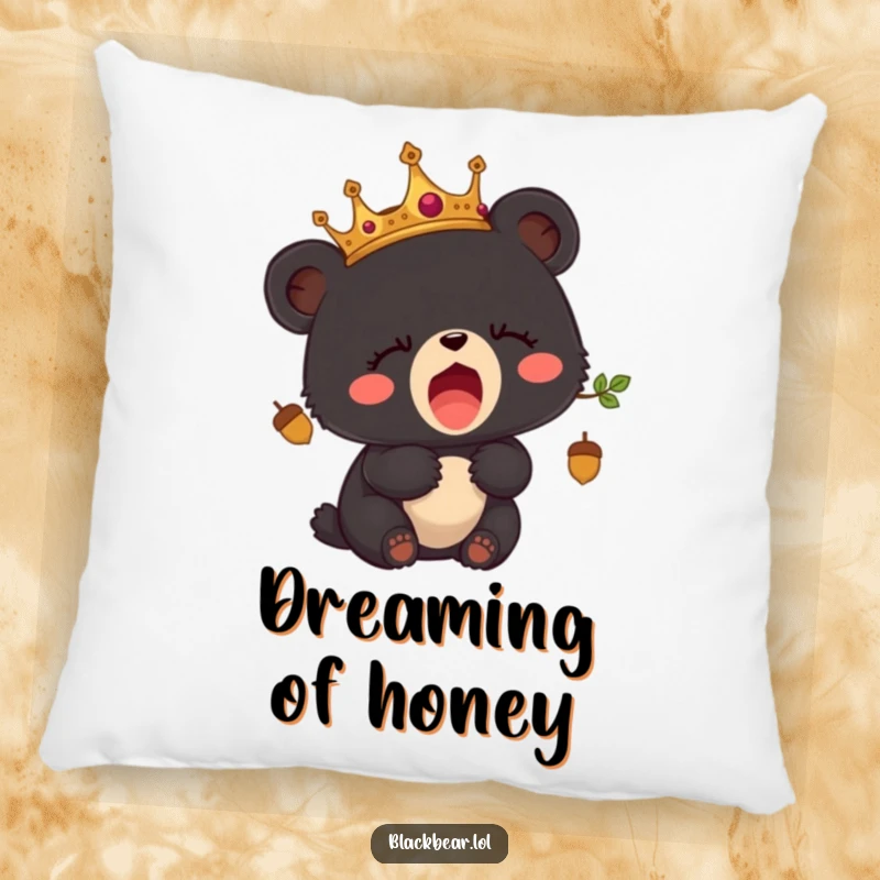 Funny pillow with a sleepy black bear cub wearing an acorn crown, yawning adorably.