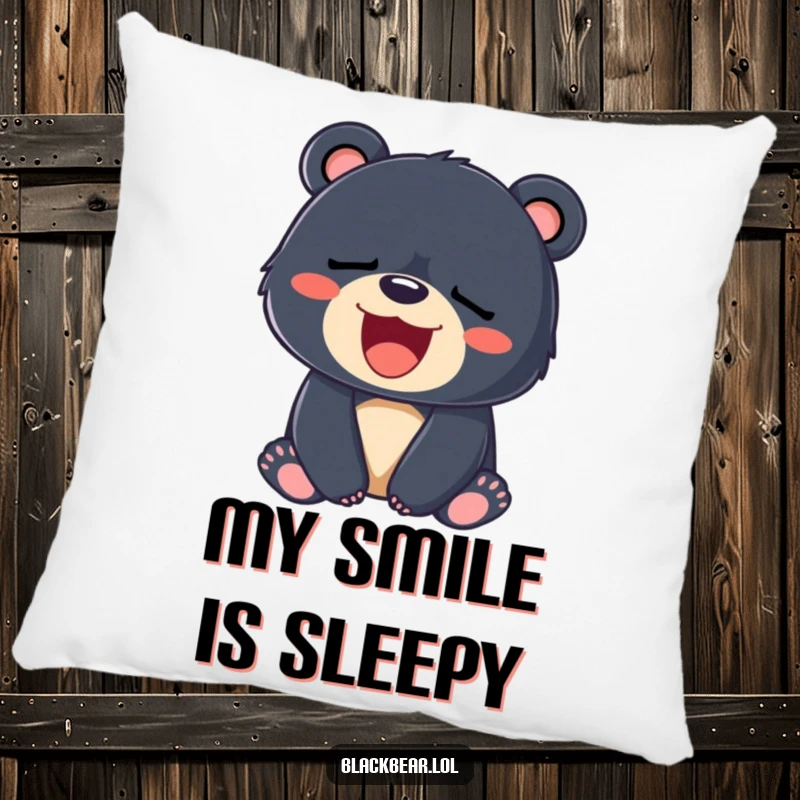 Funny pillow showing a sleepy black bear cub yawning a big, wide smile, perfect for cozy relaxation.