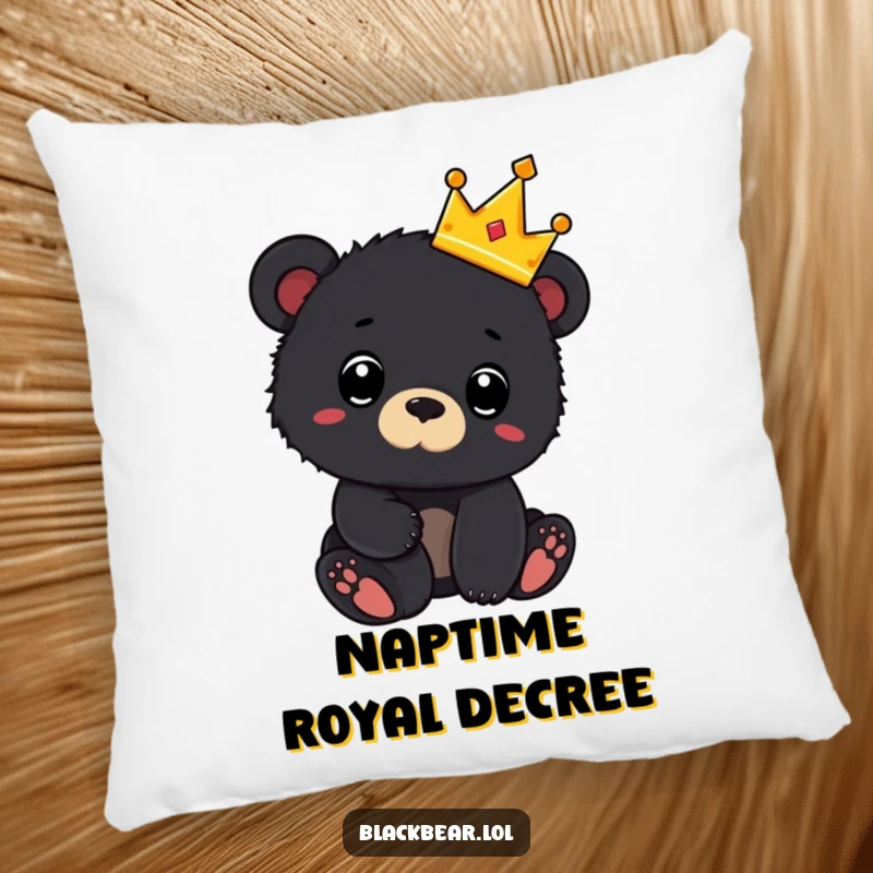 Funny pillow with a black bear cub wearing a tiny crown and looking surprised, offering soft, comfortable, and humorous decor.