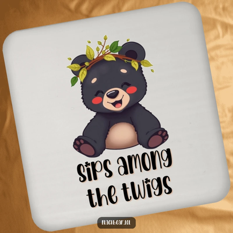 Funny coaster featuring a giggling black bear cub wearing a crown of leaves and twigs, protecting tables with joy.