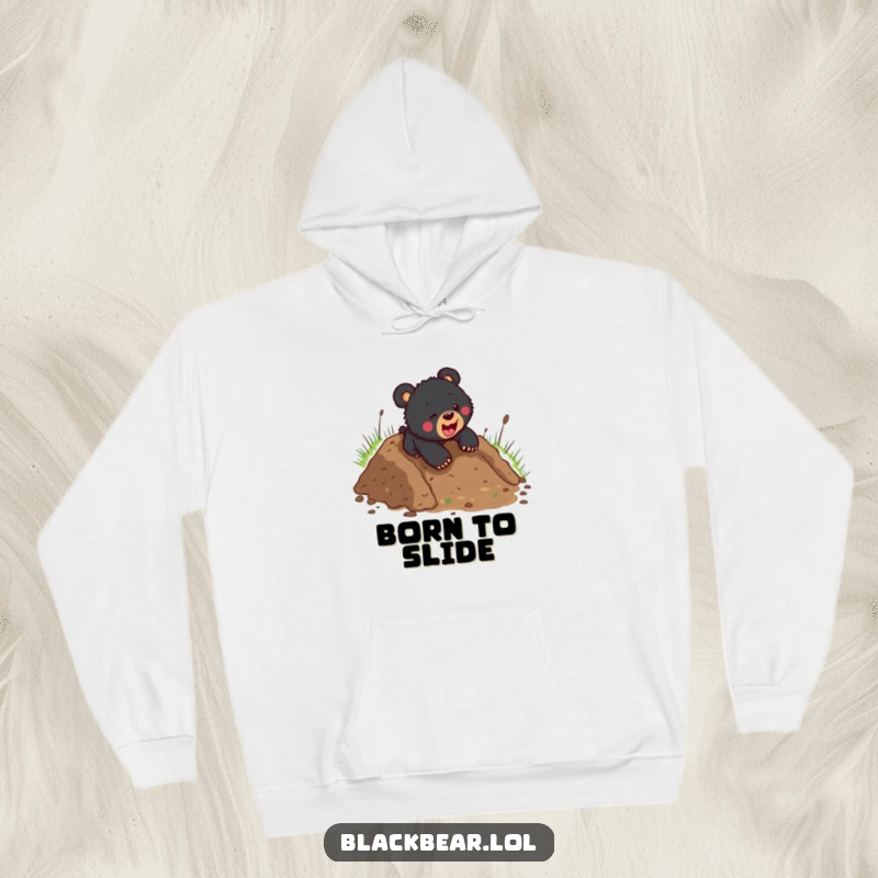 Funny black bear cub energetically sliding headfirst down a wet, muddy slope, radiating pure, unadulterated fun and adventure.