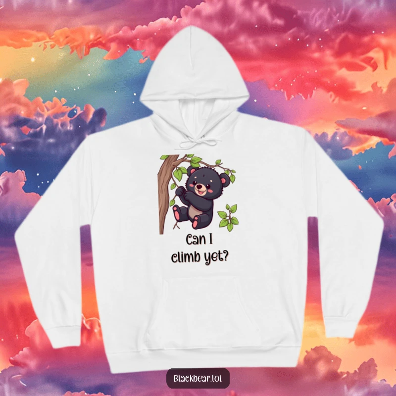 Funny black bear cub hoodie showing a playful cub tugging intently on a dangling vine, perfect for cozying up.