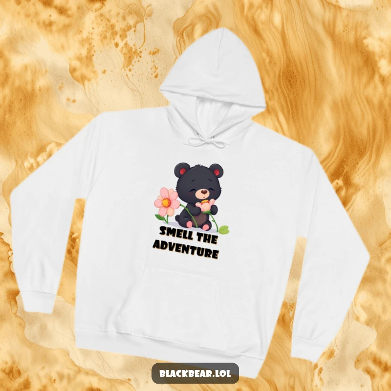 Funny curious black bear cub hoodie depicting a cub sniffing a large flower with delightful curiosity and joy.