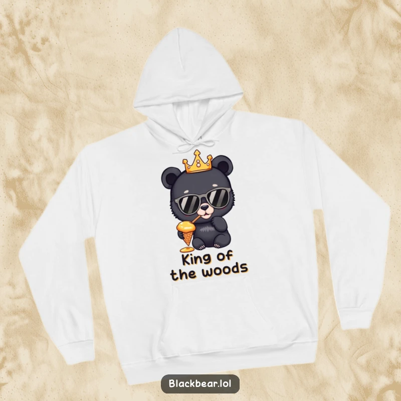 Funny Hoodie: A soft and warm hoodie depicting a curious black bear cub, adorned with a crown and sunglasses, enjoying honey from a cone.