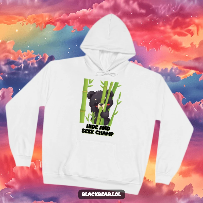 Funny black bear cub hoodie peeking from behind bamboo, offering a warm, humorous, and cozy visual for all bear enthusiasts.