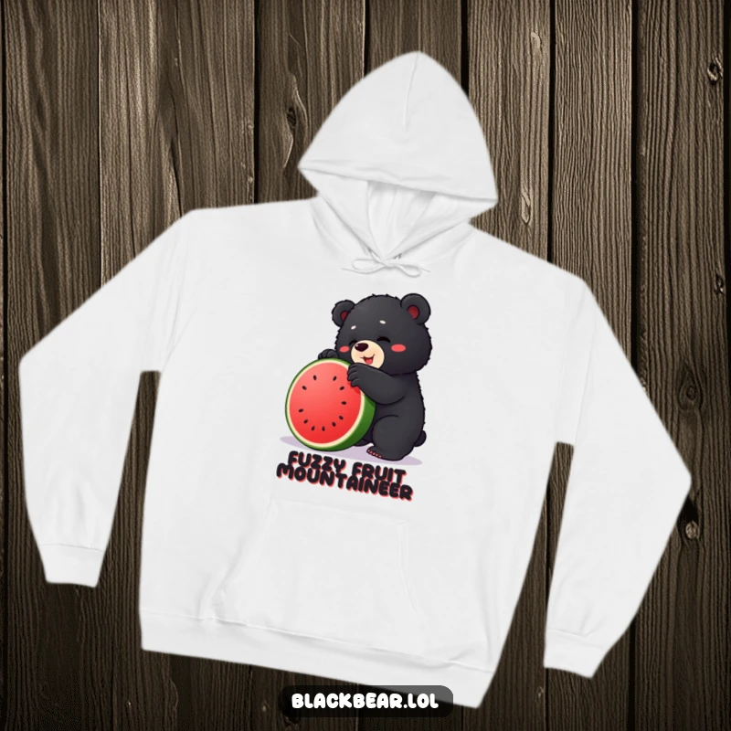 Funny hoodie showing a chubby black bear cub hilariously attempting to ascend a large, juicy watermelon.
