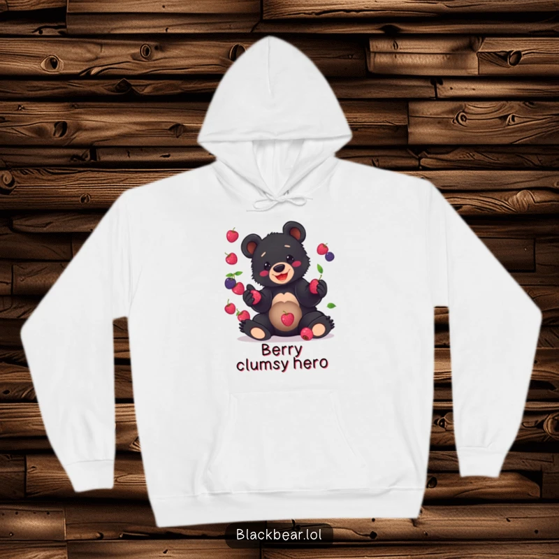 Funny Hoodie featuring a black bear cub hilariously juggling berries with a joyous expression, ideal for cozy, fun wear.