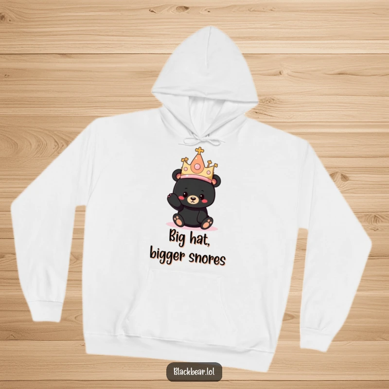 Funny hoodie depicting a black bear cub adorably sporting a comically oversized princess hat, perfect for cozy wear.