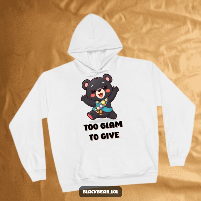 Funny hoodie showcasing a playful black bear cub in a jeweled sash, doing a comically silly dance with pure joy.