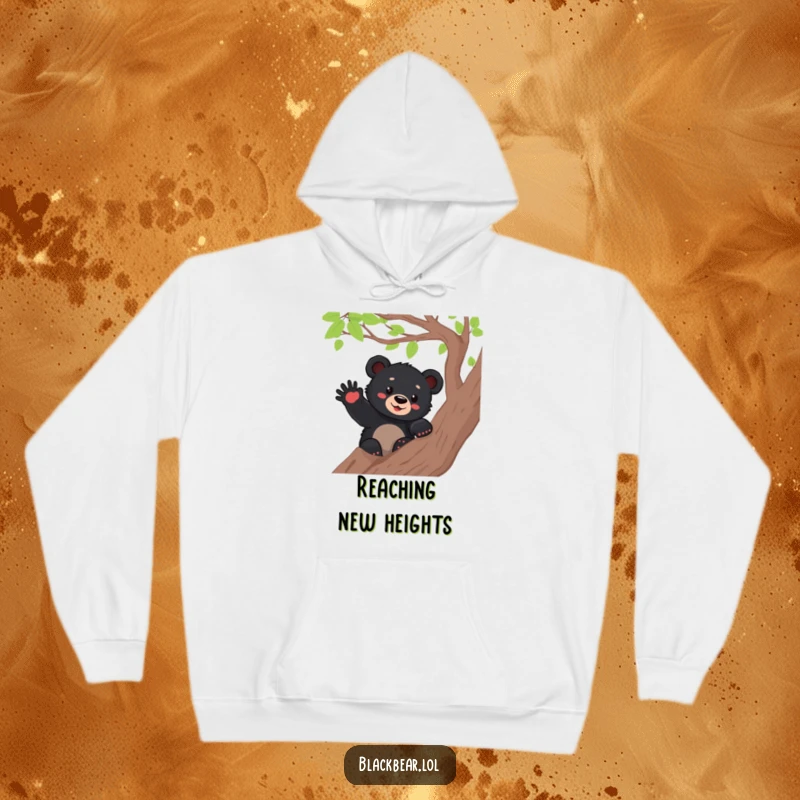 Funny black bear cub waving from a tree branch, depicted on a cozy hoodie, radiating warmth and cheerful greetings.