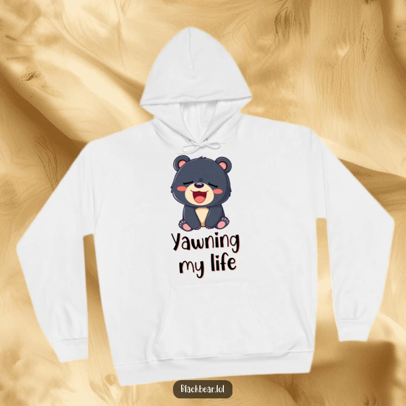 Funny hoodie featuring a sleepy black bear cub yawning adorably with a wide, happy smile.
