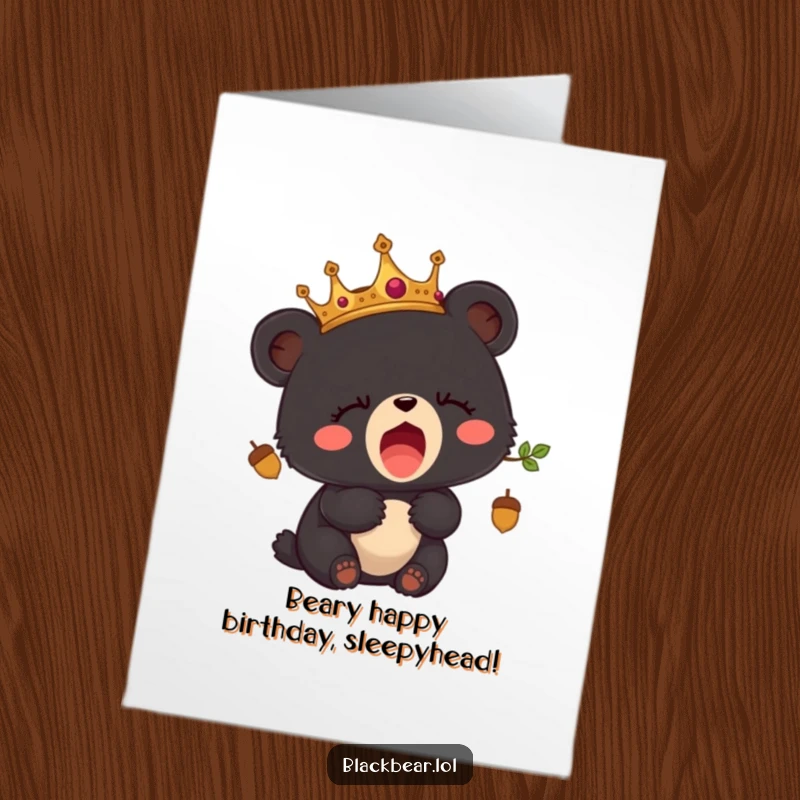 Funny free printable birthday card showing a crowned black bear cub yawning sleepily, ready for a cozy nap.