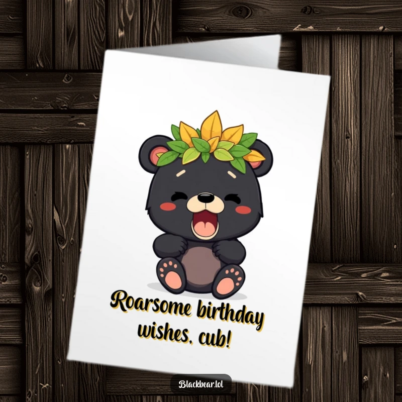 Free printable birthday card featuring a cute black bear cub with a leafy crown, letting out a happy, playful roar.