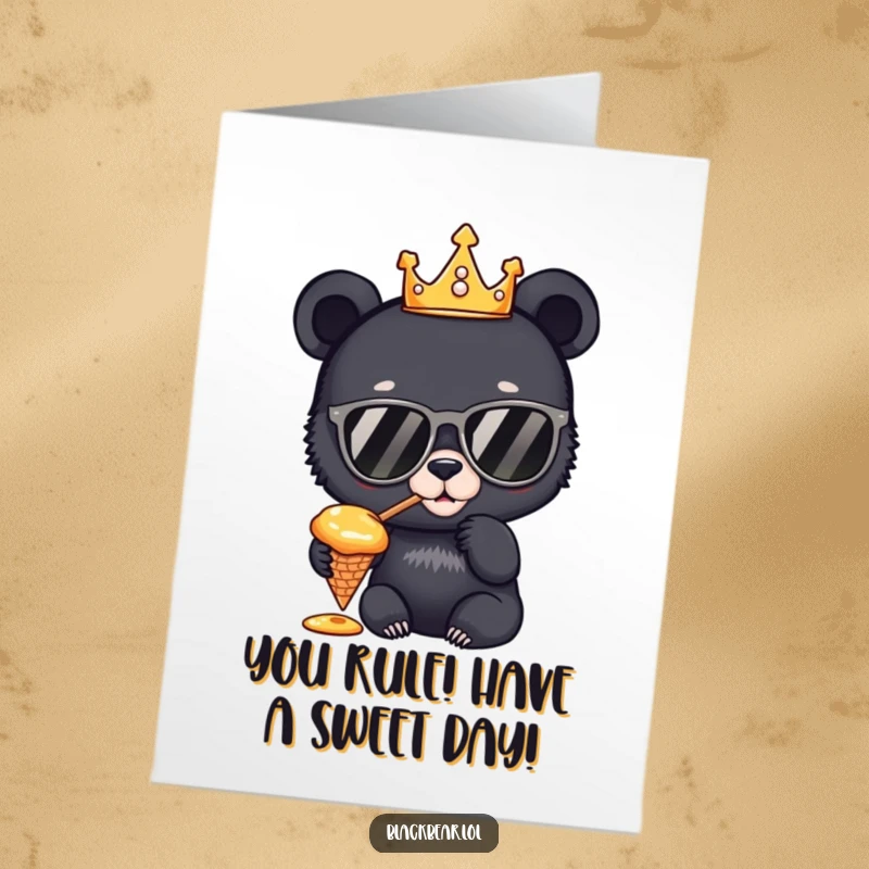 Funny Free Printable Birthday Card: A black bear cub wearing a golden crown and sunglasses tastes honey from a cone.