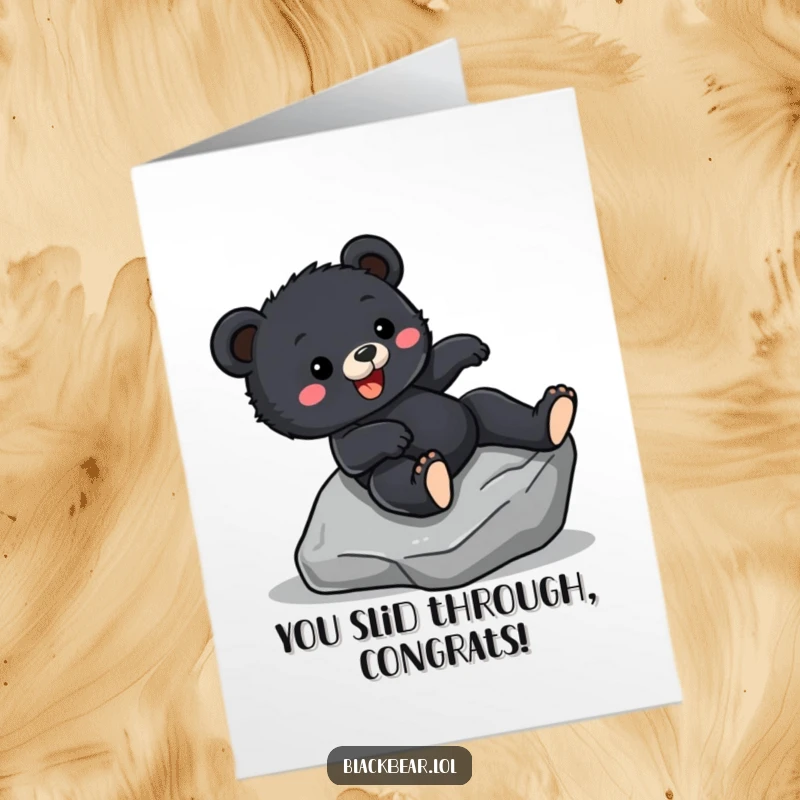 Funny Free Printable Congratulations Card: A happy black bear cub slides down a rock, celebrating a successfully achieved goal with pure excitement.
