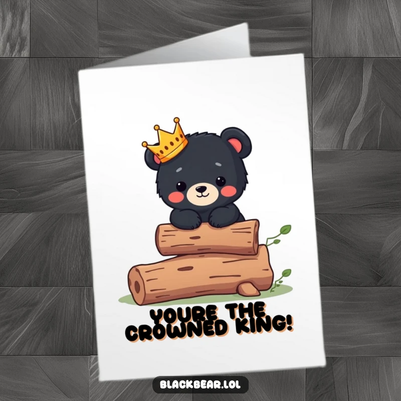 Cute Free Printable Congratulations Card showing a black bear cub with a small crown, balancing on a log, celebrating a grand achievement.