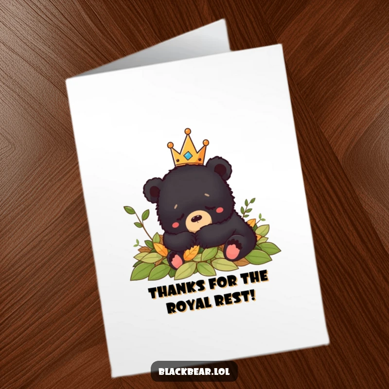 Funny Free Printable Thank You Card: Black bear cub with a crown peacefully naps in a comfy pile of fallen leaves.