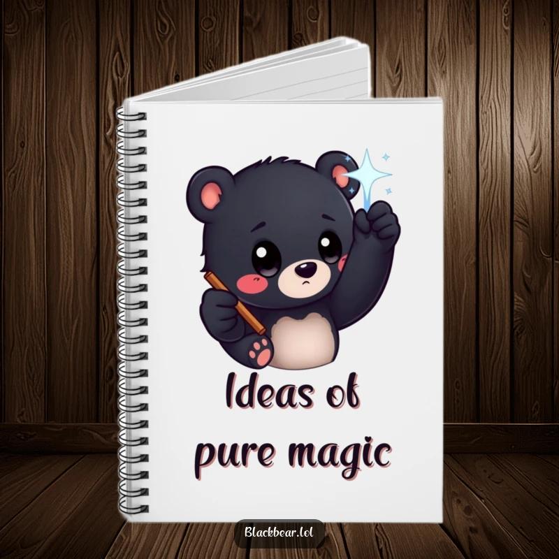 Funny black bear cub with big curious eyes reaching for a sparkling wand, featured on a notebook cover for magical writing.