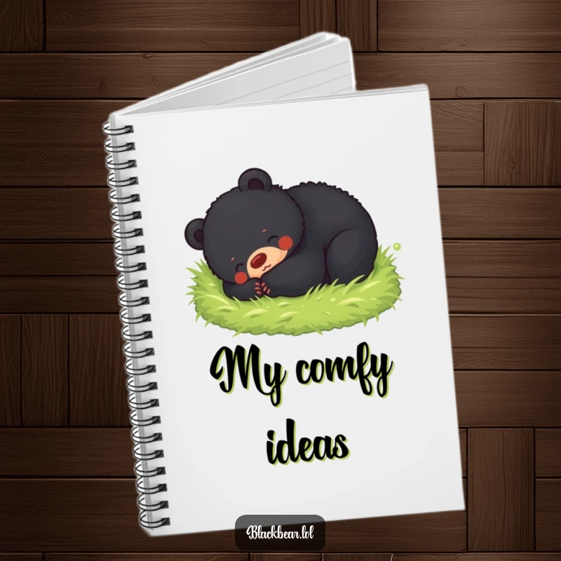 Funny notebook cover featuring a black bear cub happily rolling in soft moss, perfect for journaling peaceful thoughts.