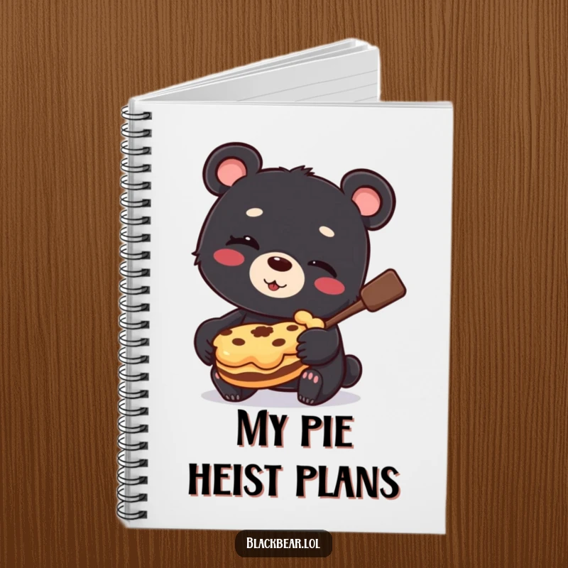 Funny Notebook cover featuring a black bear cub winking and holding a stolen pie, perfect for jotting down sweet plans.