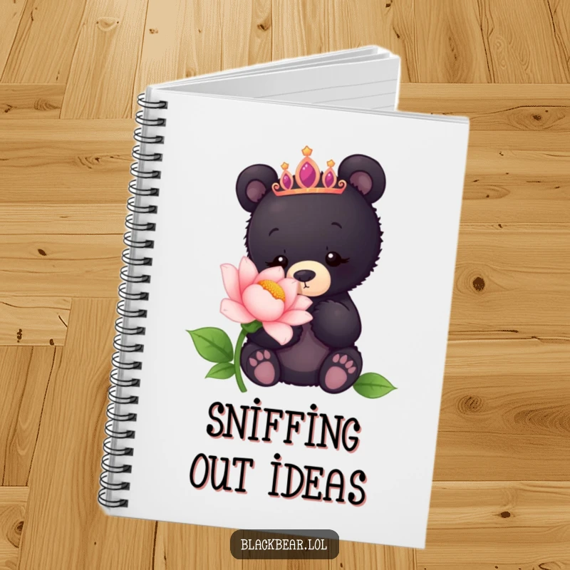 Funny notebook featuring a black bear cub wearing a tiara, curiously sniffing a giant flower, ideal for notes.