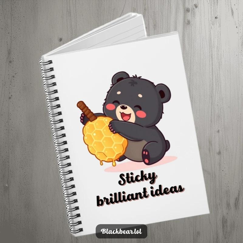 Funny black bear cub tumbling with a large honeycomb on a notebook cover. Adorable and humorous forest animal stationery.