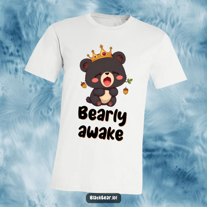 Funny t-shirt with a sleepy black bear cub sporting an acorn crown, captured mid-yawn.