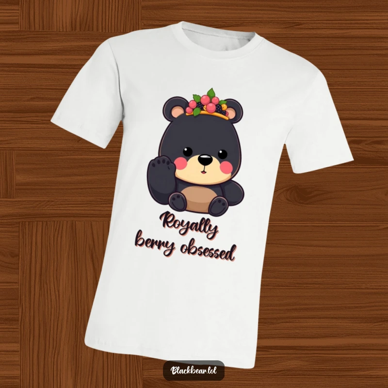 Funny Black Bear King T-Shirt, wearing a berry crown and offering a paw, conveying a regal and humorous personality.