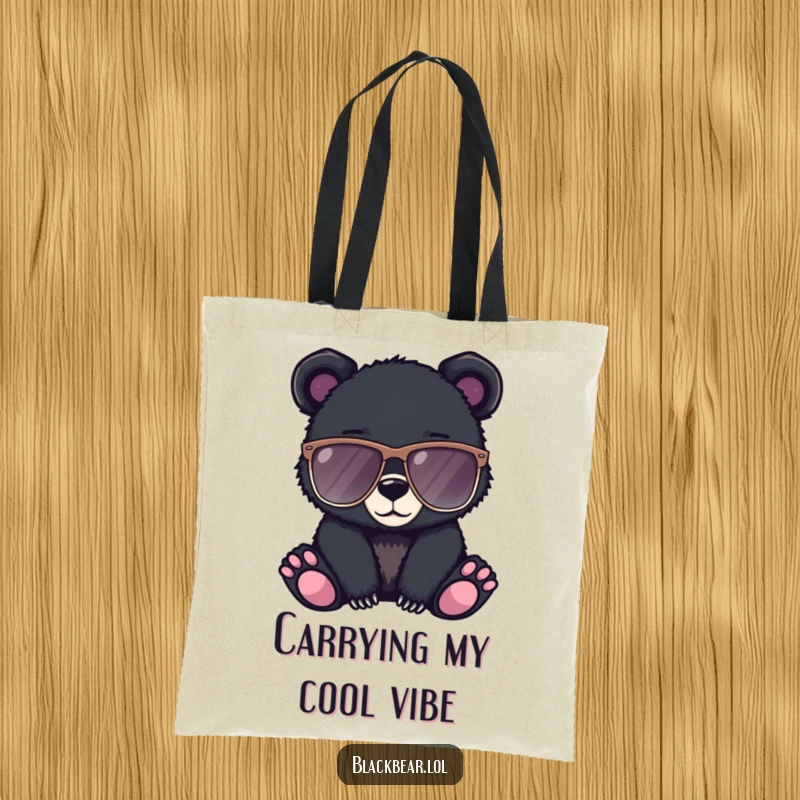 Funny tote bag featuring a black bear cub looking super cool in oversized sunglasses, ready for a stylish day out.