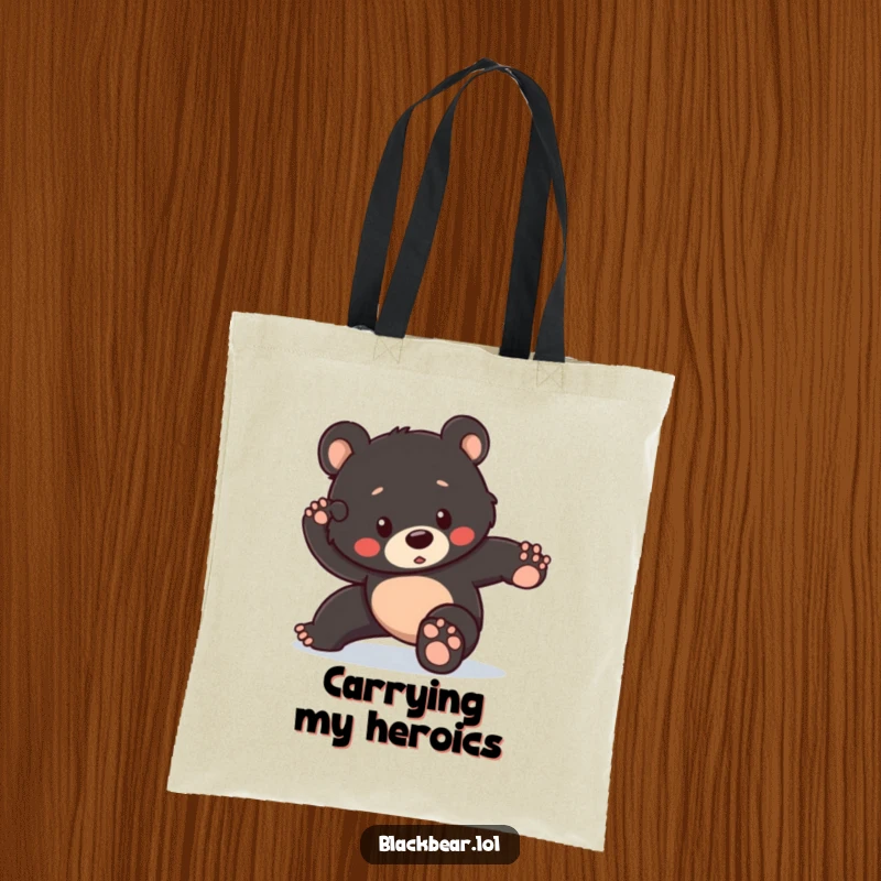 Funny tote bag featuring a black bear cub attempting a heroic pose but tripping slightly, perfect for carrying your valiant efforts.
