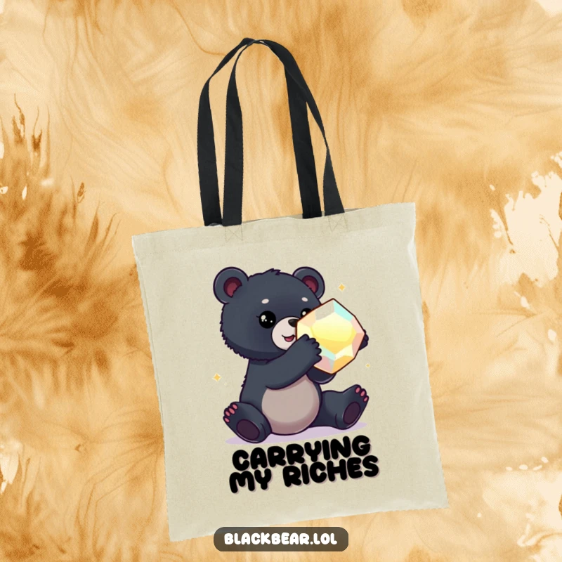 Funny tote bag with a black bear cub reaching out towards a large, glittering, oversized gem.