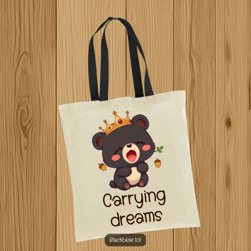 Funny tote bag showcasing a sleepy black bear cub wearing an acorn crown and yawning.