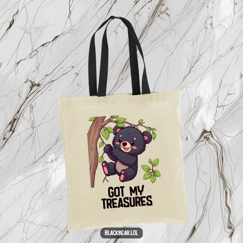 Funny black bear cub tote bag with a playful cub tugging on a vine, showcasing wild cuteness and humor.
