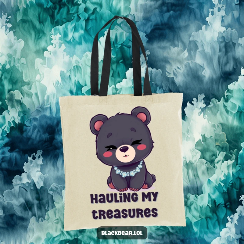 Funny tote bag with a black bear cub winking charmingly while wearing a flashy, glittery necklace.